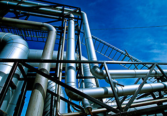 Image showing Industrial zone, Steel pipelines and valves against blue sky