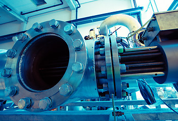 Image showing different size and shaped pipes and valves at a power plant 