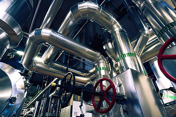 Image showing Equipment, cables and piping as found inside of a modern industr