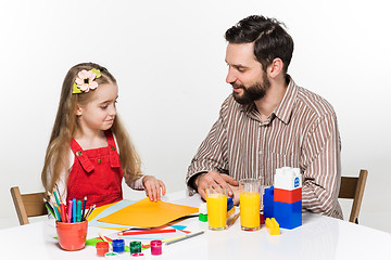 Image showing The daughter and father drawing together