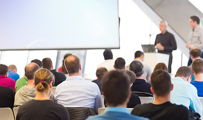 Image showing Male speeker having talk at public event.