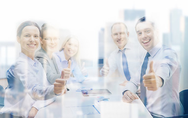 Image showing business team showing thumbs up in office