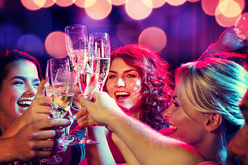 Image showing smiling friends with glasses of champagne in club