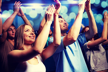 Image showing smiling friends at concert in club