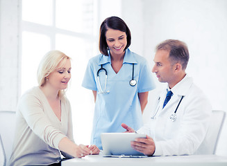 Image showing doctor and nurse with patient in hospital