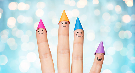 Image showing close up of hand with four fingers in party hats