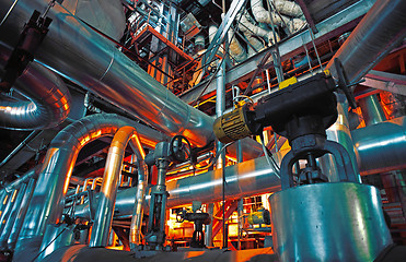 Image showing Equipment, cables and piping as found inside of a modern industr