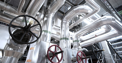 Image showing Equipment, cables and piping as found inside of a modern industr