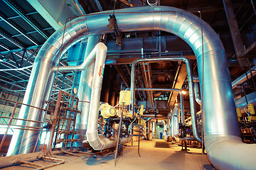 Image showing Equipment, cables and piping as found inside of a modern industr