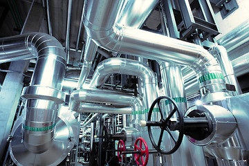 Image showing Equipment, cables and piping as found inside of a modern industr