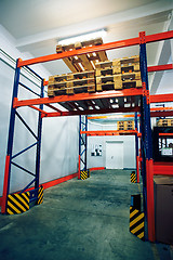 Image showing Shelves and racks with pallets in distribution warehouse interio