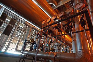 Image showing Equipment, cables and piping as found inside of a modern industr