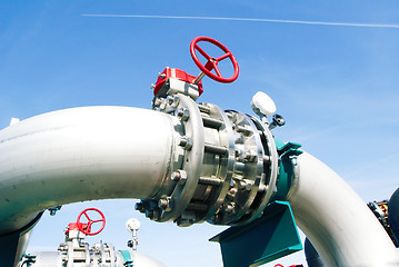 Image showing Industrial zone, Steel pipelines and valves against blue sky