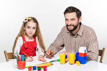 Image showing The daughter and father drawing together