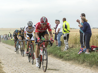 Image showing Group of Cyclists on a Cobblestone Road - Tour de France 2015