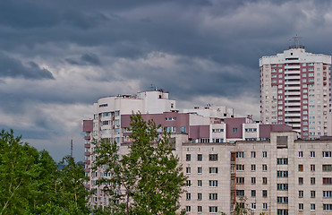 Image showing Cityscape in the background of dark cloudy sky