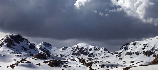 Image showing Panoramic view on snowy mountains in clouds