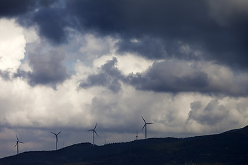 Image showing Wind farm and cloudy sky before storm