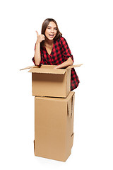 Image showing Young woman with cardboard boxes