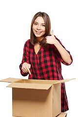 Image showing Young woman with cardboard boxes