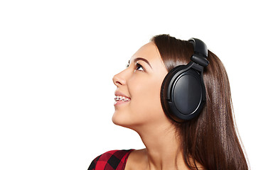 Image showing Female listening enjoying music in headphones