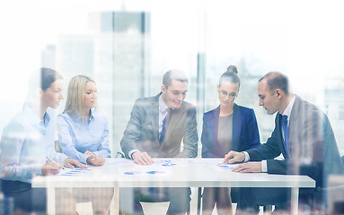 Image showing business team with documents having discussion