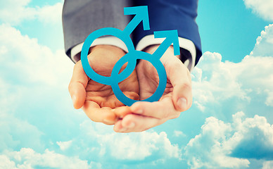 Image showing close up of male gay couple holding gender symbol