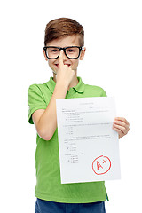 Image showing happy boy in eyeglasses holding school test result