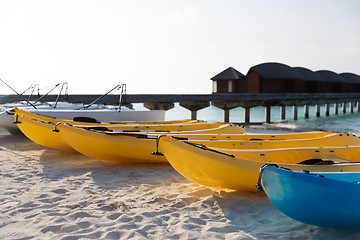 Image showing canoes or kayaks mooring on sandy beach