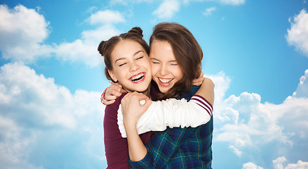 Image showing happy smiling pretty teenage girls hugging