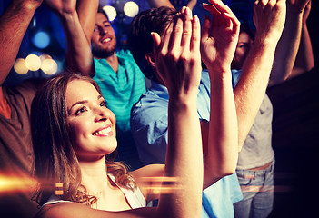 Image showing smiling friends at concert in club