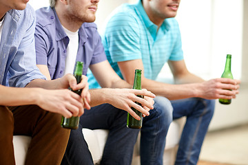 Image showing happy male friends with beer watching tv at home