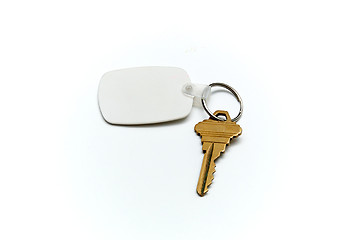 Image showing Keyring with  house key and fob over white