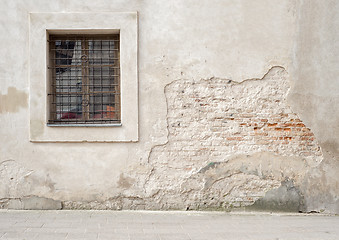 Image showing abandoned cracked brick wall with a window