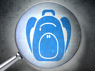 Image showing Learning concept: Backpack with optical glass on digital background