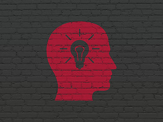 Image showing Advertising concept: Head With Light Bulb on wall background