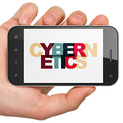Image showing Science concept: Hand Holding Smartphone with Cybernetics on  display