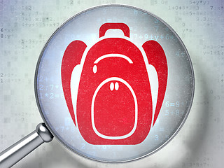 Image showing Learning concept: Backpack with optical glass on digital background