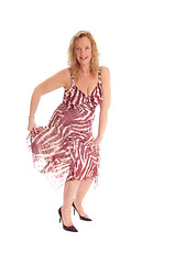 Image showing Blond woman dancing in summer dress.