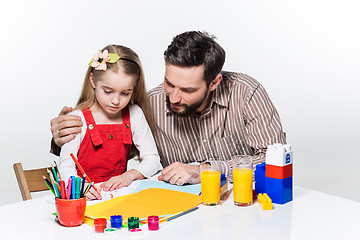 Image showing The daughter and father drawing together