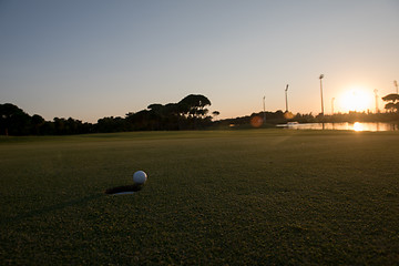 Image showing golf ball on edge of  the hole