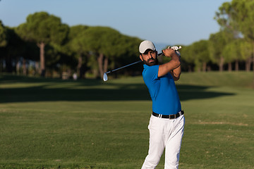 Image showing pro golfer hitting a sand bunker shot