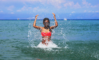 Image showing Girl splashing seawater