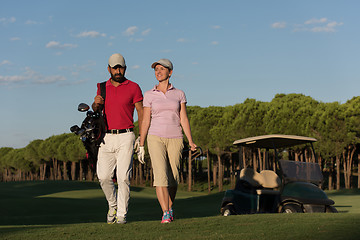 Image showing couple walking on golf course