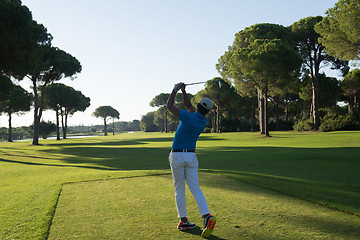 Image showing golf player hitting shot