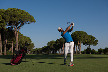 Image showing golf player hitting shot