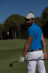 Image showing golf player portrait from back