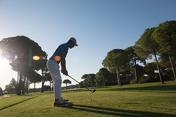 Image showing golf player hitting shot