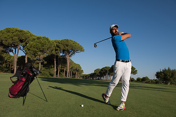 Image showing golf player hitting shot