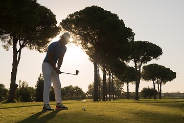 Image showing golf player hitting shot